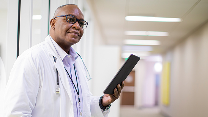 Doctor with tablet