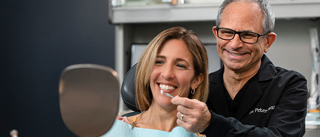 Medical professional helping patient with whitening